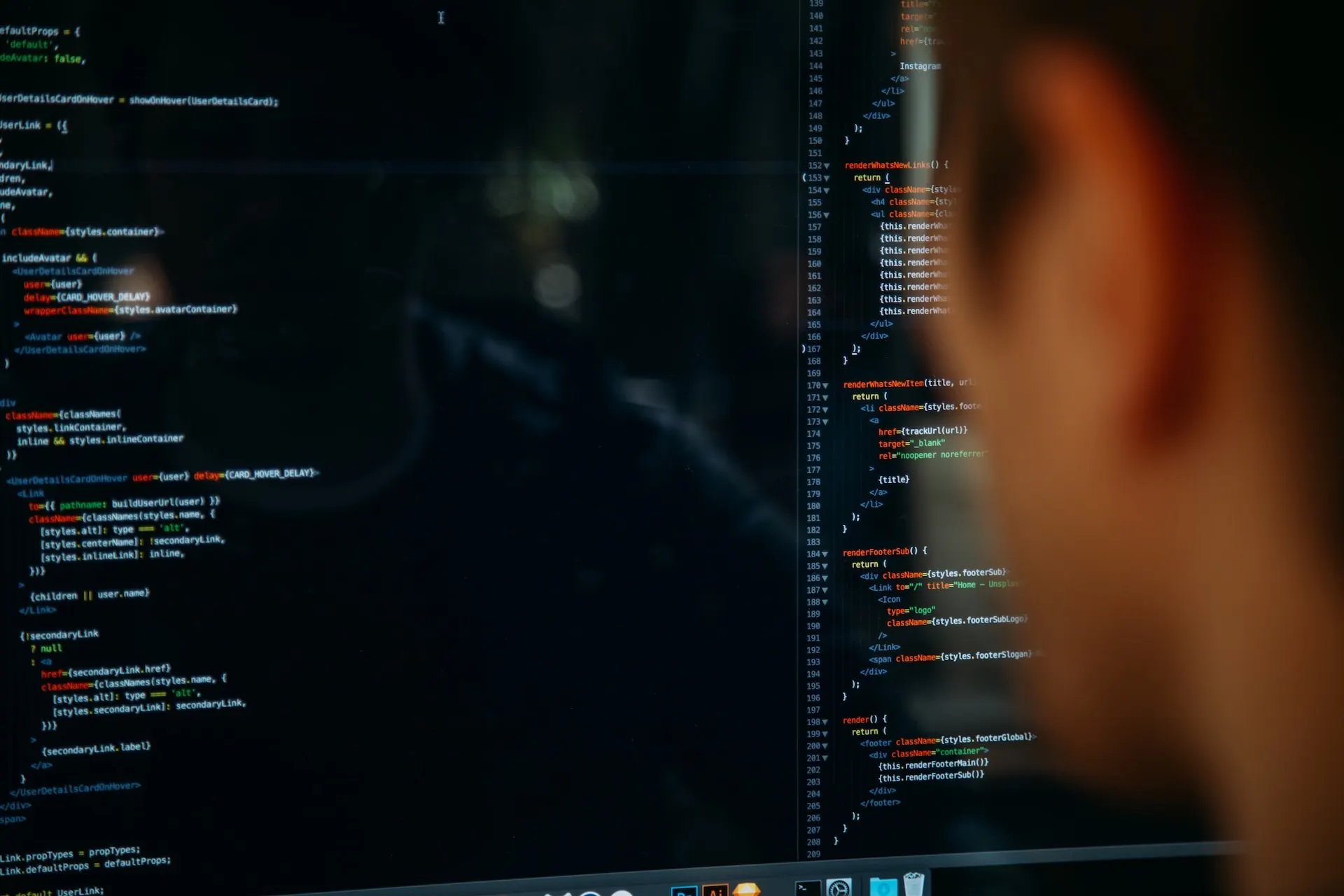 A person coding on desktop