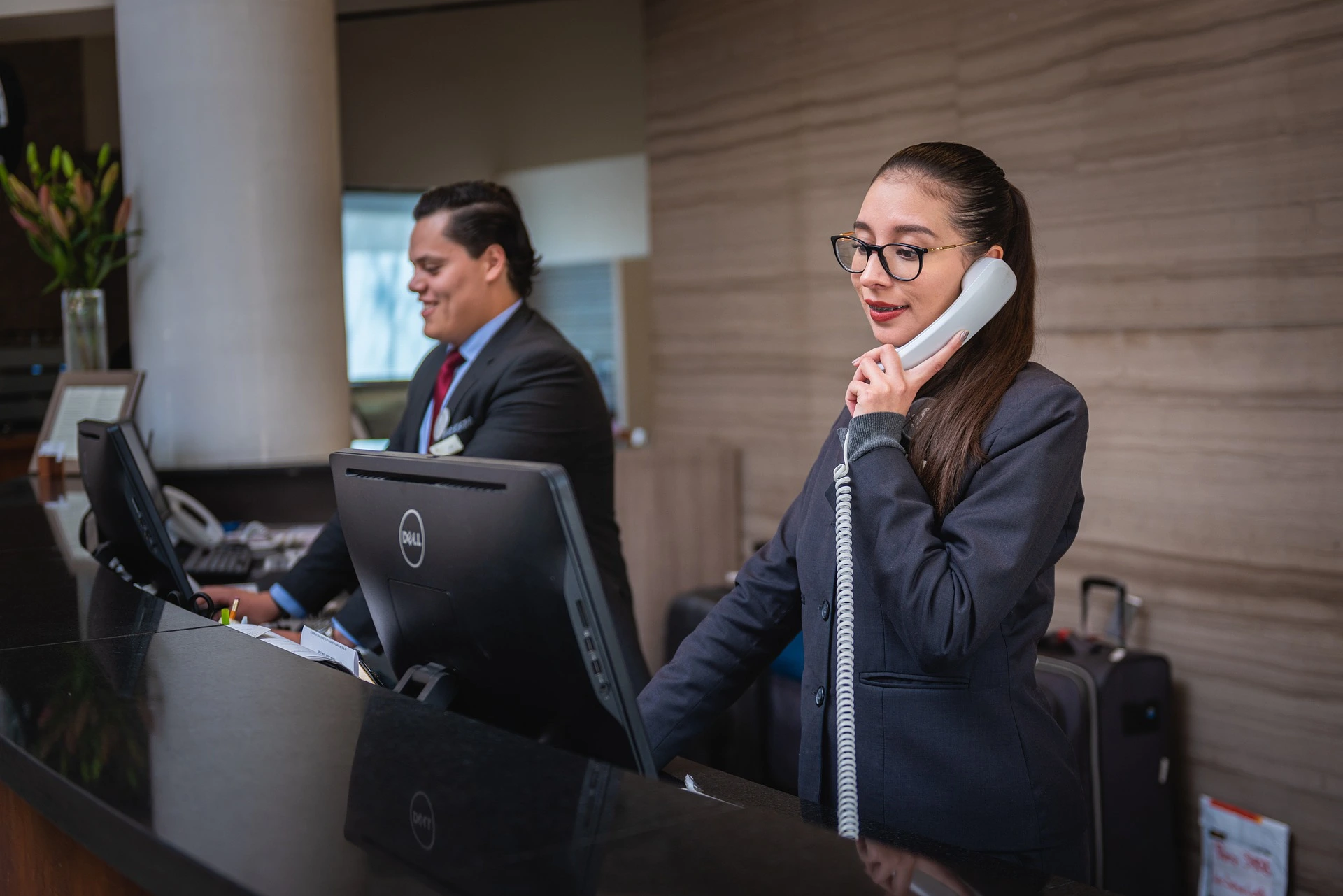 Women talking on phone on reception